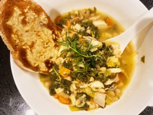 bowl of white bean and chicken soup after cooked in instant pot