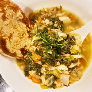 bowl of white bean and chicken soup after cooked in instant pot